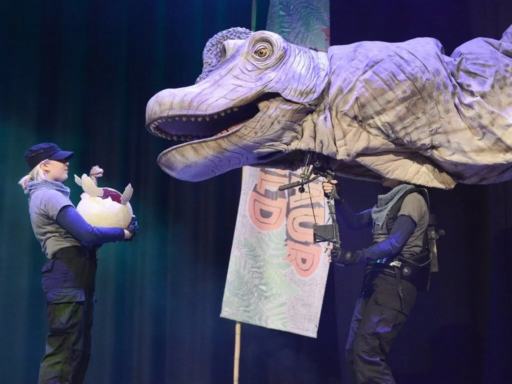 dinosaur puppet in theatre