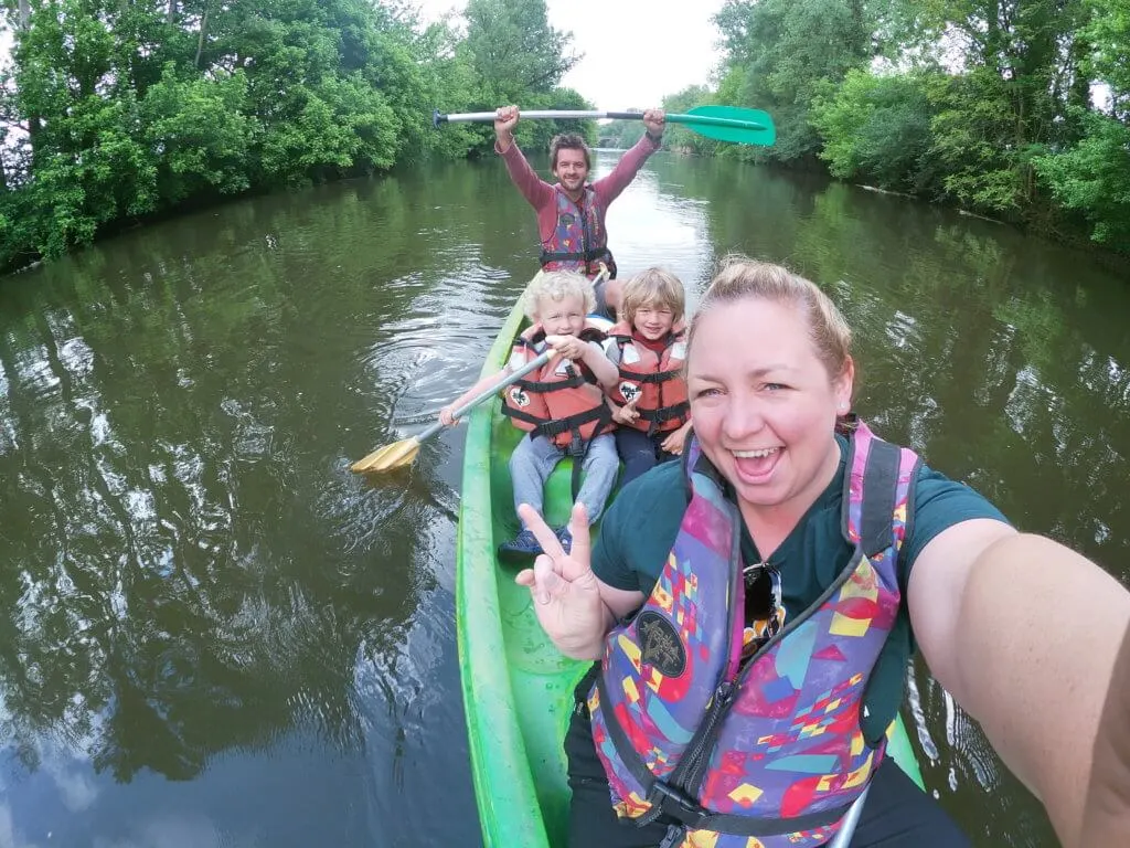 family in kayak on river