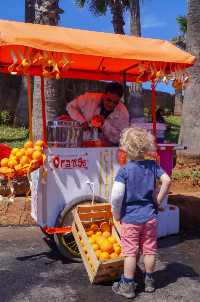 boy buying orange juice