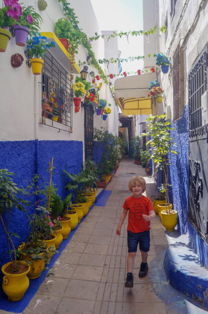 boy walking down street in Rabat