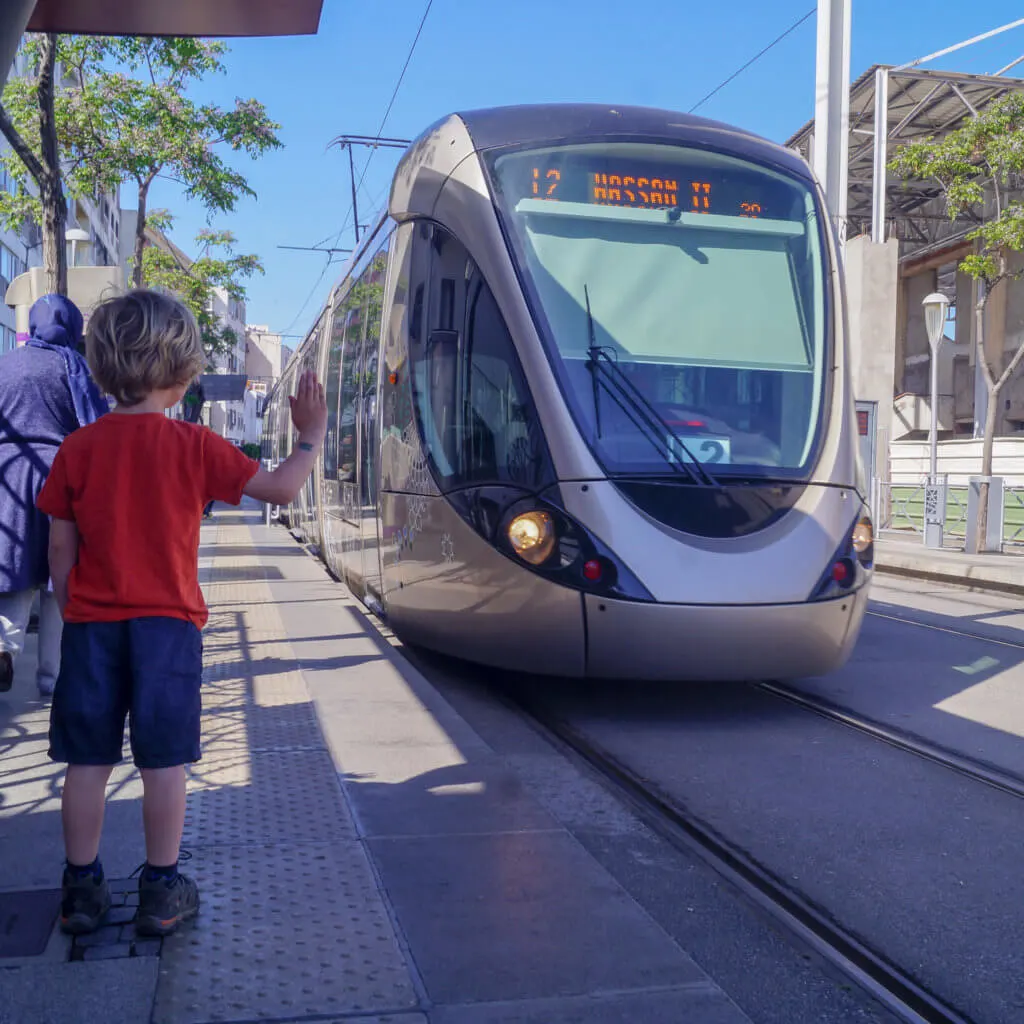 a boy stopping a tram