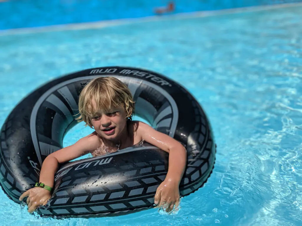 boy in siwmming tube