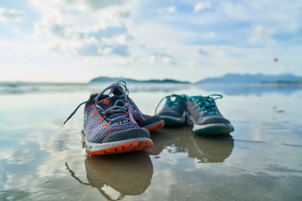 running trainers on beach