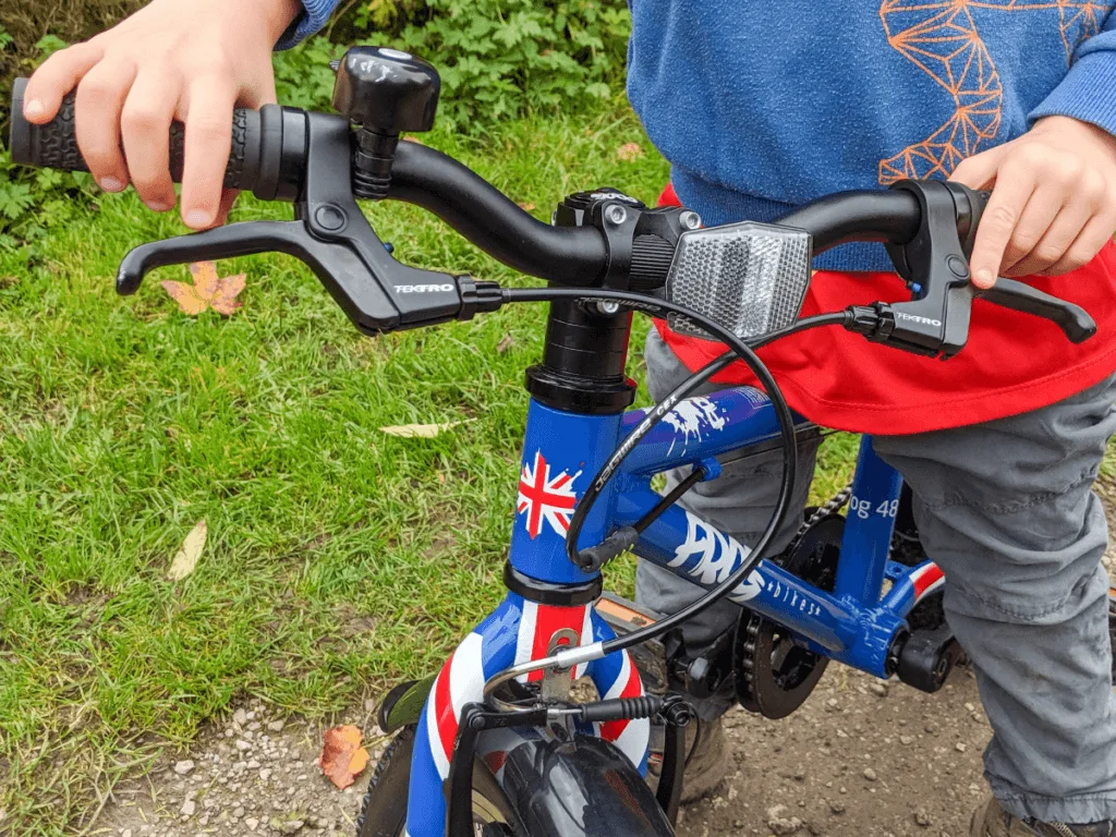 Raising handlebars on store frog bike