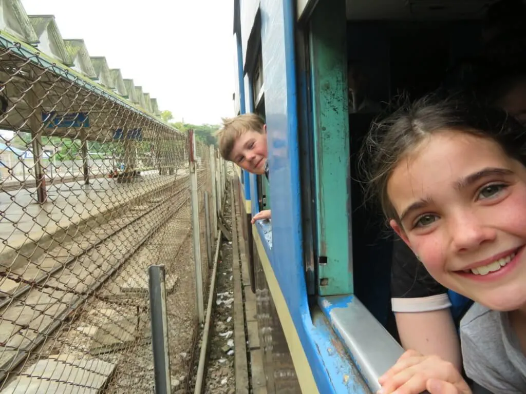 riding the train in Yangon with kids