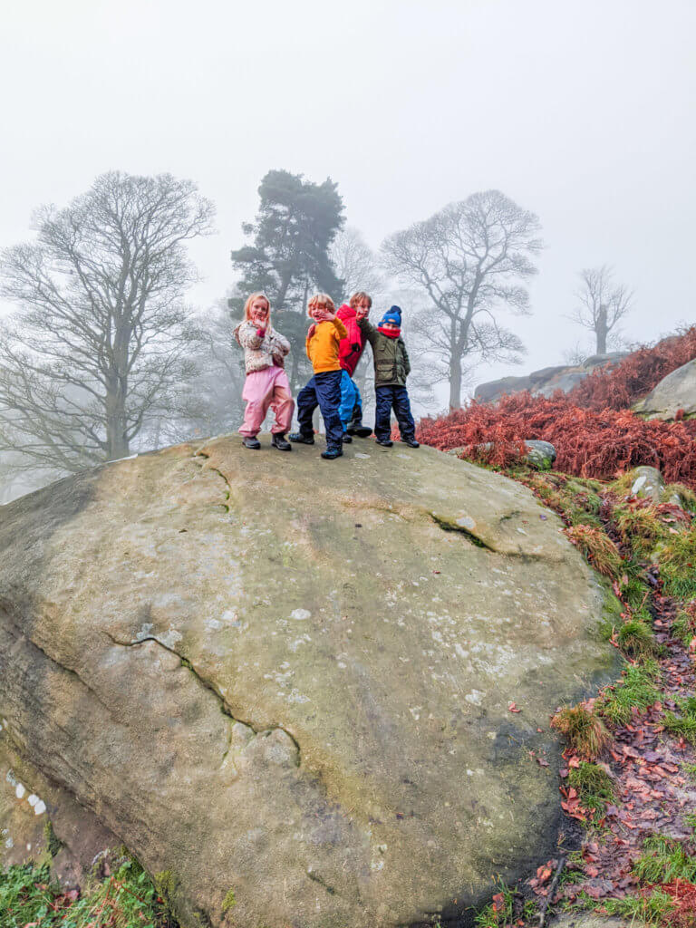 kids on top of boulder in Peak District