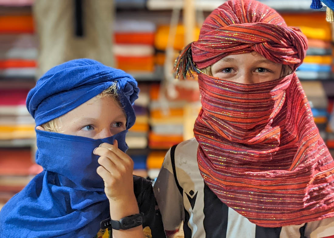 Moroccan head dress on kids in Fes Medina