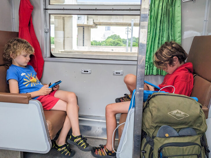 Southeast Asia reading on train kids